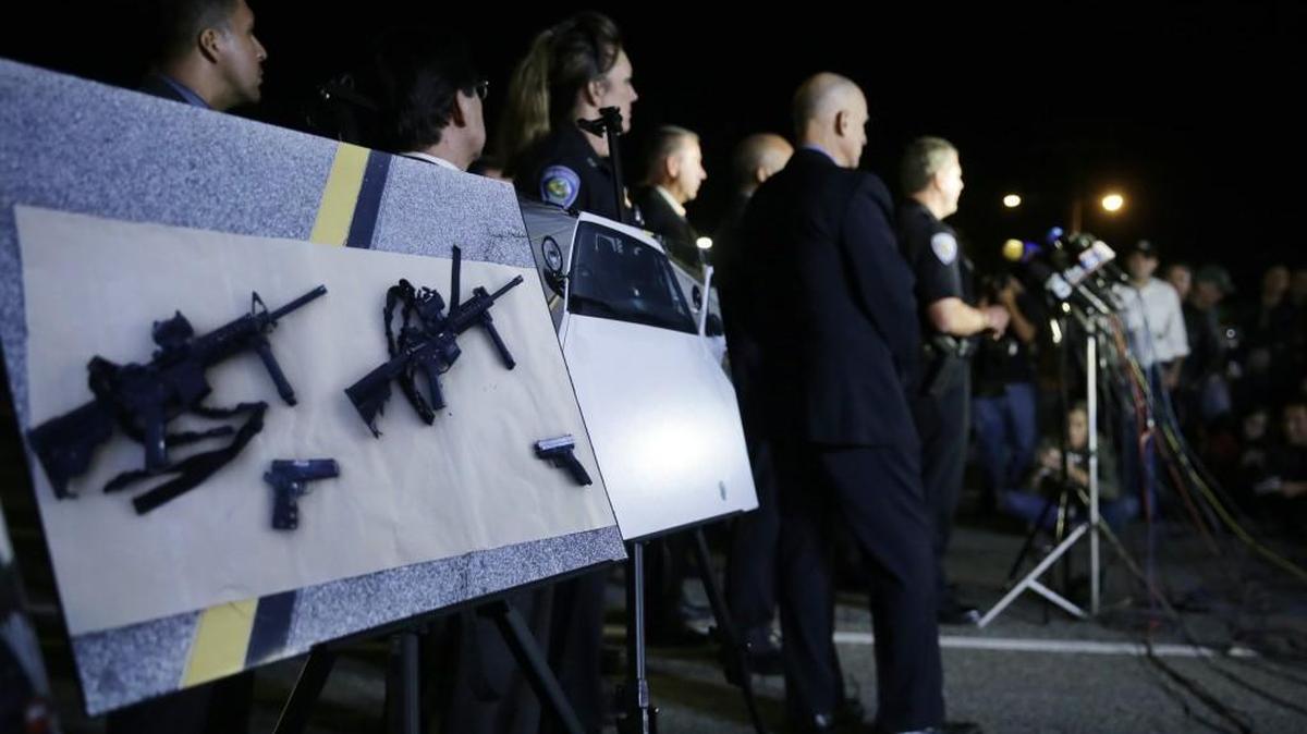 Police crime photos are displayed during a press conference last week near the site of the mass killing in San Bernardino, Calif.