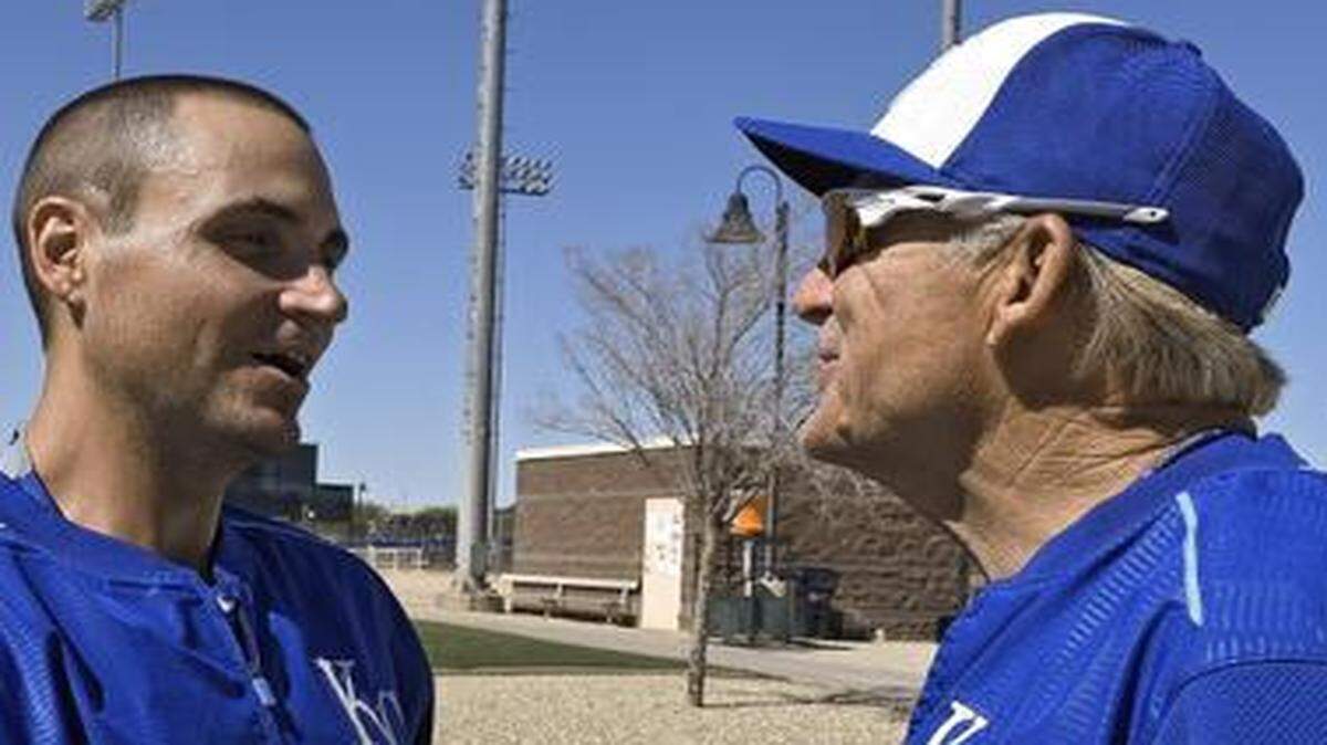 
Chris Young (left), who met first-base coach Rusty Kuntz after signing with Kansas City on Saturday, plans to pitch in his first game as a Royal in Friday’s Cactus League contest against Oakland. 
