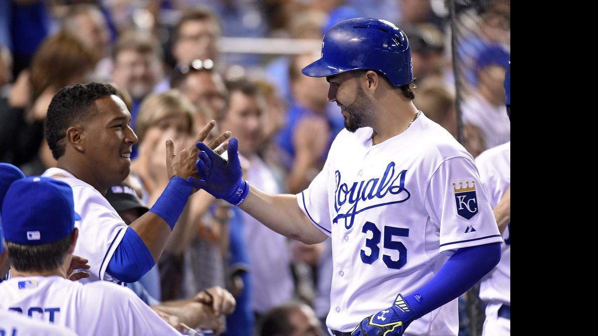 
Kansas City Royals' Salvador Perez (13) congratulates Eric Hosmer (35) after his solo home run in a baseball game against the Boston Red Sox on June 19, 2015. Hosmer will sit out this series against the Houston Astros due to a sprained finger.
