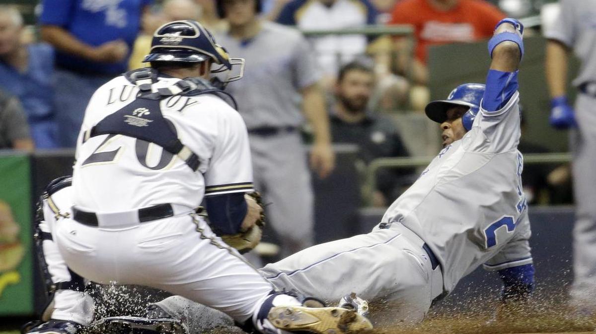 
The Royals’ Alcides Escobar scored ahead of the tag of Milwaukee Brewers catcher Jonathan Lucroy during Monday’s game.
