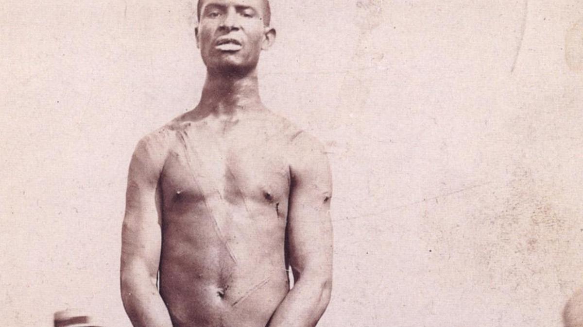 In a field northeast of Fayette, Mo., Frank Embree stood before a mob moments before he was to be lynched in 1899.