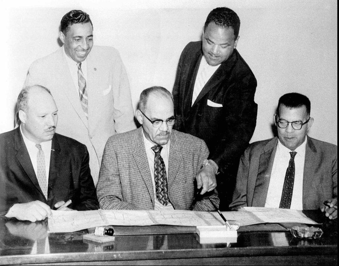 Five of the founding members of Freedom Inc. look over a map of the city’s 14th Ward. The 14th, Freedom’s home base, delivered a 97.8 percent majority for the 1964 public accommodations referendum, the highest of any ward. From left: Charles Moore, Fred Curls, Leon Jordan, Bruce Watkins and Howard Maupin.