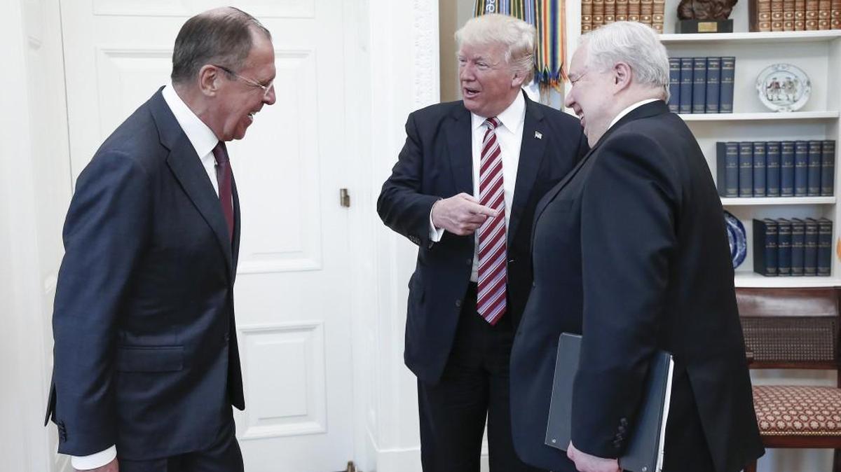 From left, Russia’s Foreign Minister Sergei Lavrov, U.S. President Donald Trump, and Russian Ambassador to the United States Sergei Kislyak talk during a meeting in the Oval Office at the White House on May 10, 2017.
