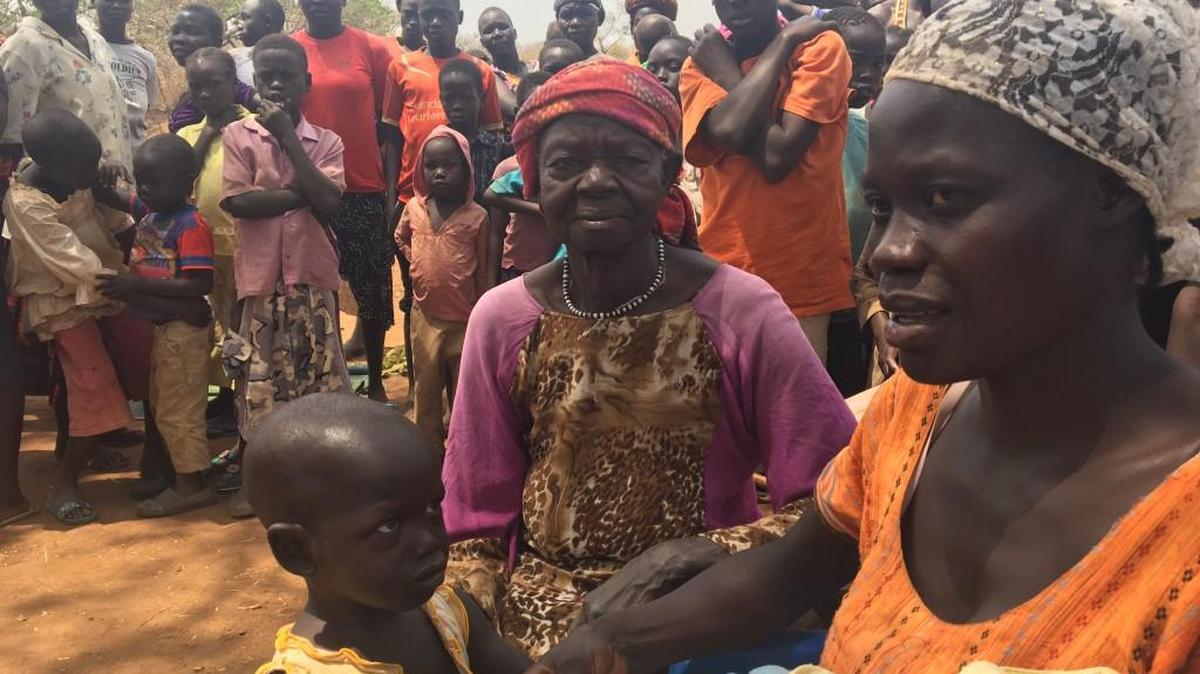 Halima Muzammil (right) fled her home in Kajo-Keji, South Sudan, with only her clothes and her children after watching her husband shot and killed by government soldiers in a country that the U.N. says is on the brink of genocide.