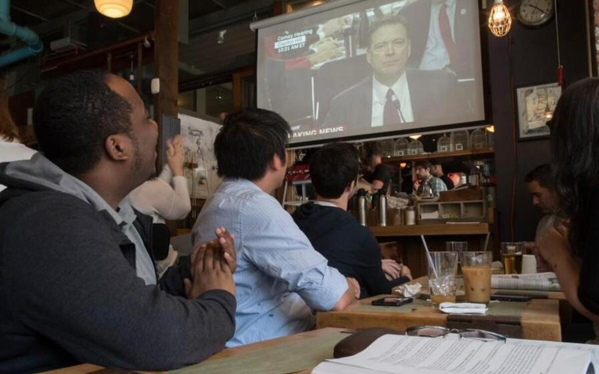 Kenji Logie, of Berkley, Calif., was among at public watch parties for former FBI Director James Comey’s testimony Thursday at a Senate Intelligence Committee hearing. Logie watched at the Building on Bond in New York.