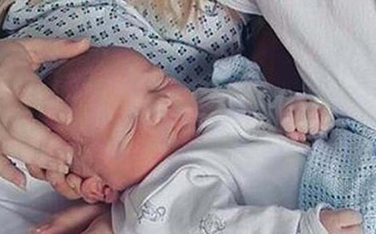 Chris Gard and Connie Yates with their son Charlie at Great Ormond Street Hospital, in London.