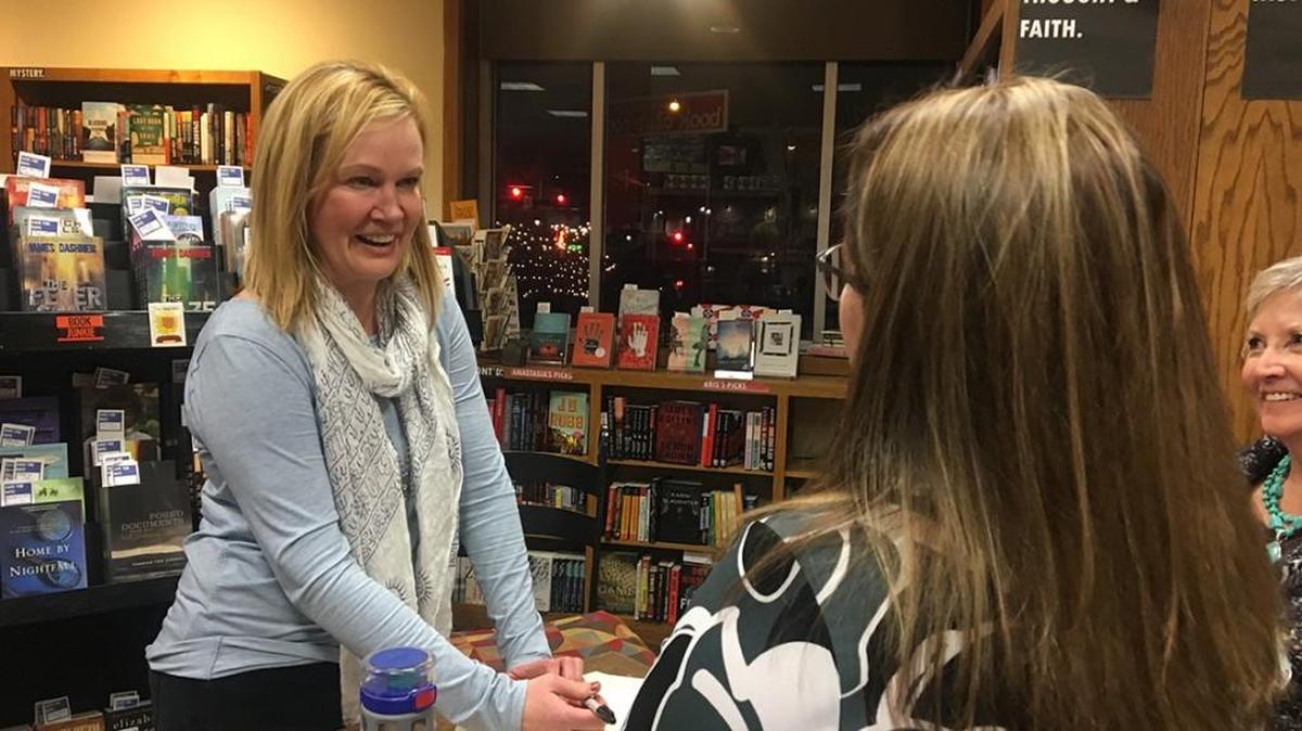 Laura Moriarty signs copies of her controversial new novel “American Heart” at Watermark Books in Wichita on Tuesday.