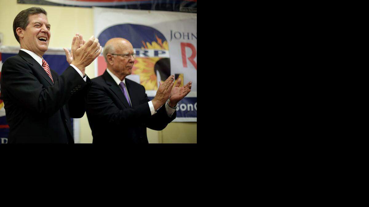 
Kansas Gov. Sam Brownback (left) and U.S. Sen. Pat Roberts celebrated at a Johnson County primary election watch party.
