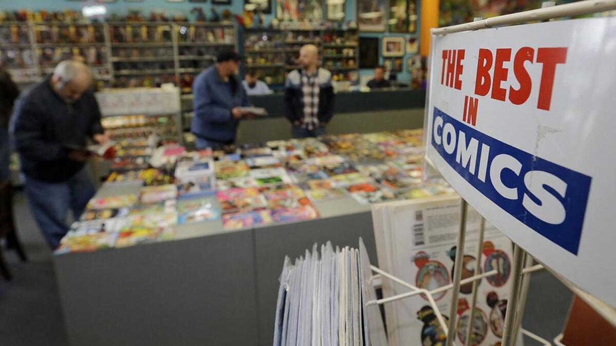 Customers browse for comic books during New Comic Day at Carol & John’s Comic Book Shop, Wednesday, Nov. 8, 2017, in Cleveland. (AP Photo/Tony Dejak)
