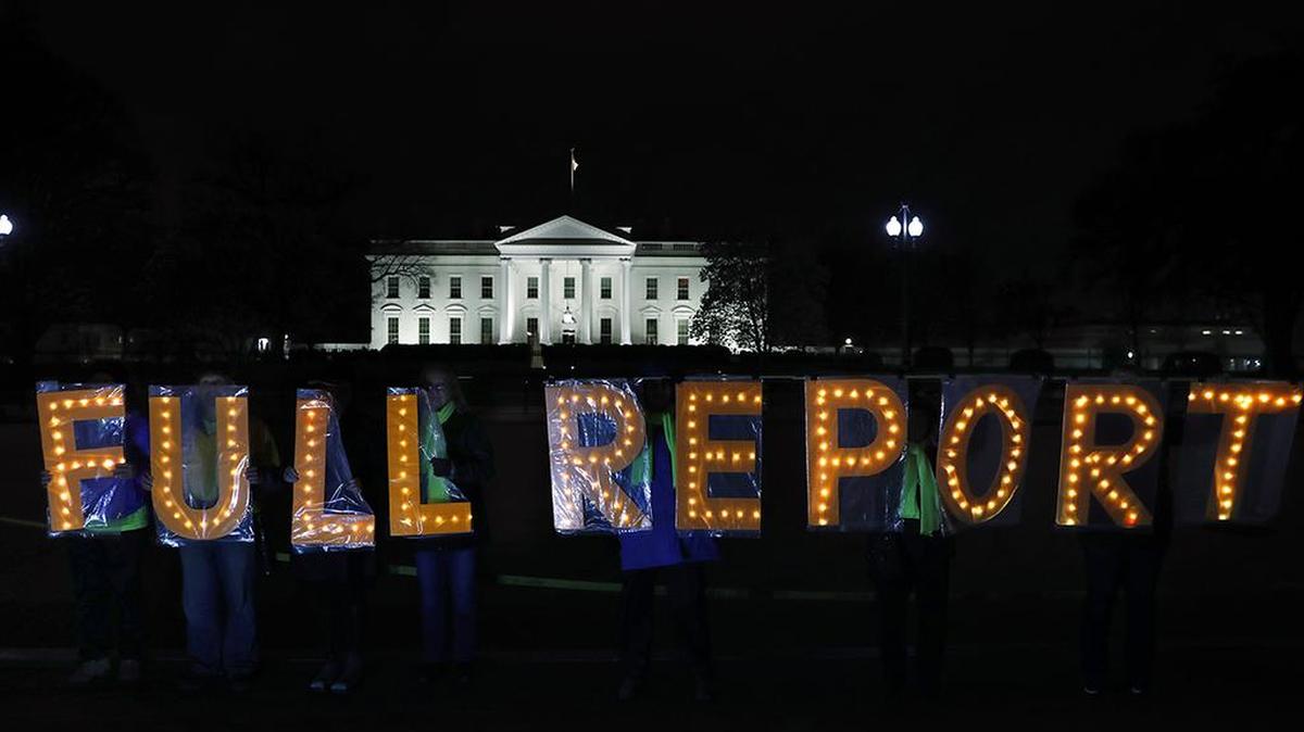Members of the protest group Herndon Reston Indivisible and Kremlin Annex hold signs saying “Full Report,” outside the White House in Washington, Monday, March 25, 2019, as they protested for the complete results to be released of special counsel Robert Mueller’s investigation into Russian election interference.