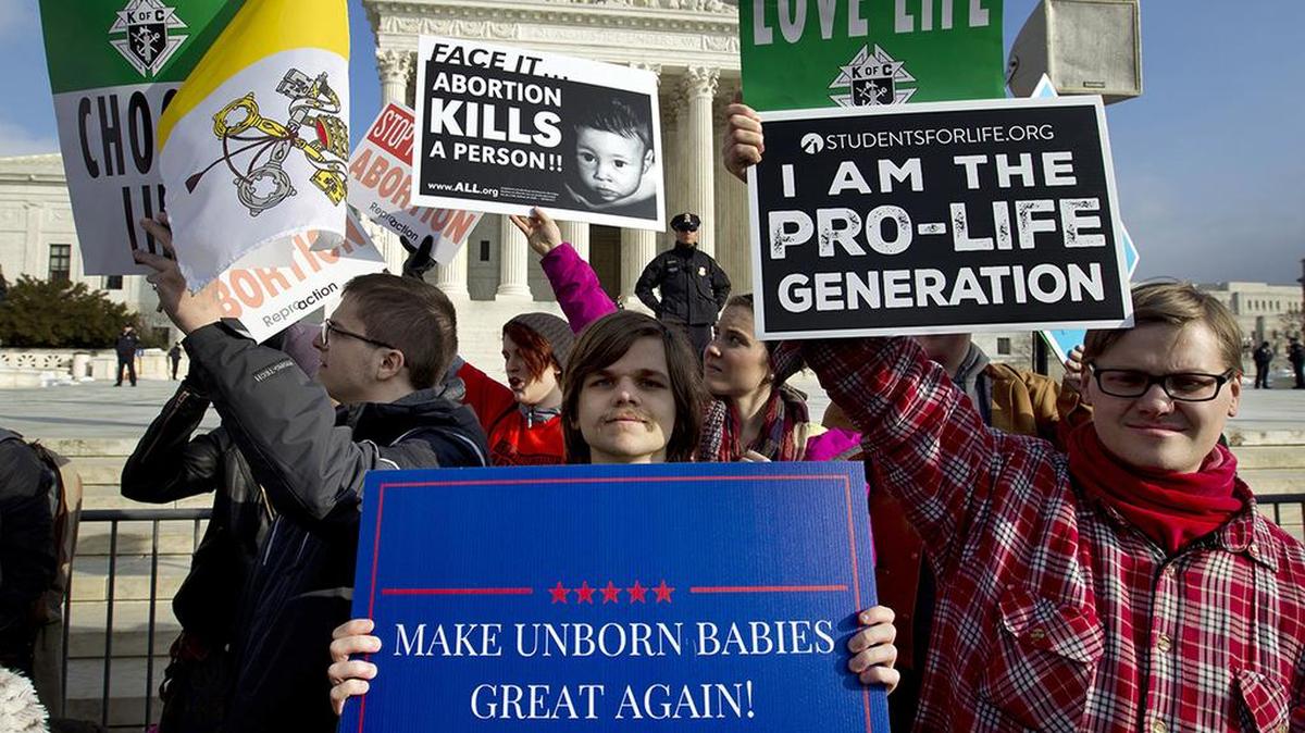 FILE - In this Jan. 18, 2019, file photo, anti-abortion activists protest outside of the U.S. Supreme Court, during the March for Life in Washington. Emboldened by the new conservative majority on the Supreme Court, anti-abortion lawmakers and activists in numerous states are pushing near-total bans on the procedure in a deliberate frontal attack on Roe v. Wade. (AP Photo/Jose Luis Magana, File)