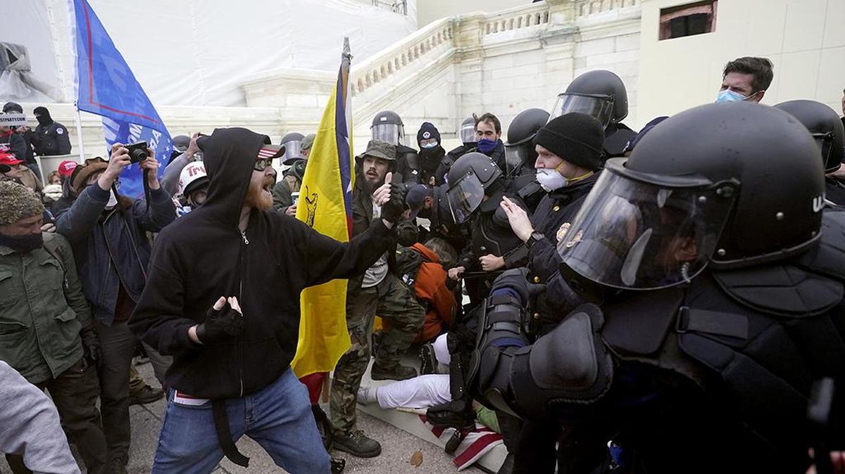 Supporters of President Donald Trump try to break through a police barrier on Wednesday, Jan. 6, 2021, at the Capitol in Washington.