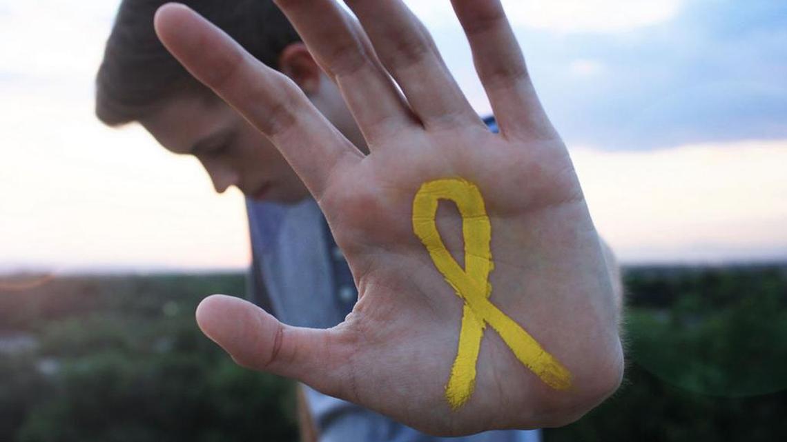 Yellow ribbons are used to signify support for suicide prevention.