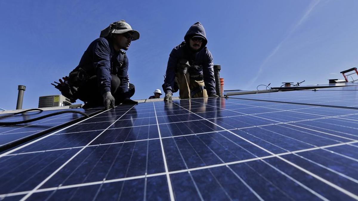 A crew installs a solar system on home in 2016.