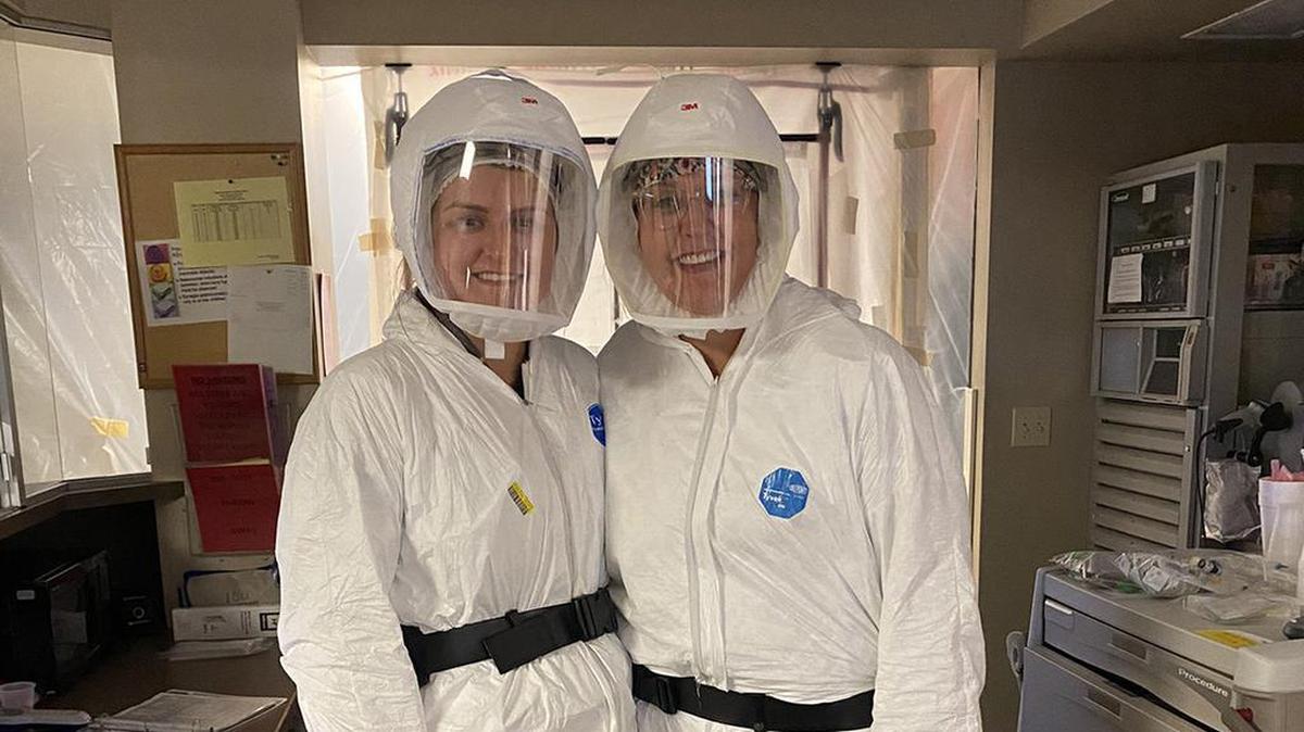 South Dakota emergency room nurse Jodi Doering, right, poses in personal protective gear with her daughter Abby, who is also a nurse.
