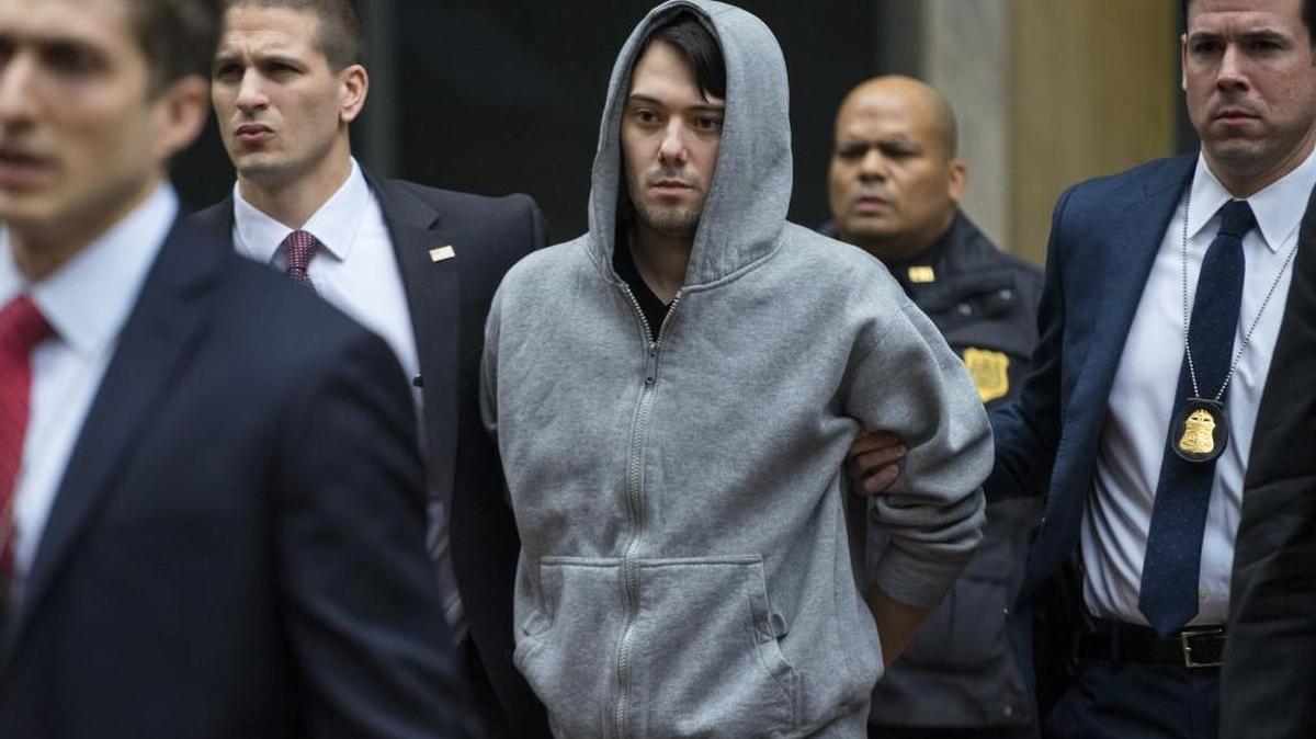 Martin Shkreli, the former hedge fund manager under fire for buying a pharmaceutical company and ratcheting up the price of a lifesaving drug, was escorted by law enforcement agents in New York after being taken into custody following a securities probe. Shkreli has resigned as the head of one of the companies he now runs, Turing Pharmaceuticals.
