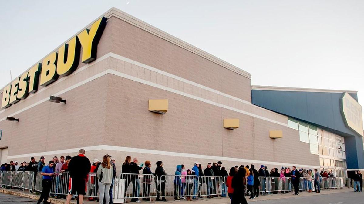 Holiday shoppers line up ahead of a sale in this file photo. Debit and credit transaction data from SafeGraph indicates many Kentucky shoppers are spending less this year than last.