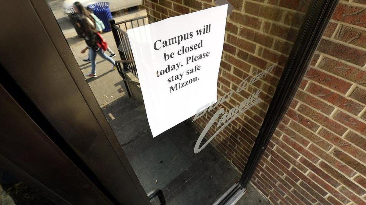 A sign on the door of the Campus Bar & Grill, across the street from the University of Missouri campus, showed that it was closed Wednesday morning.