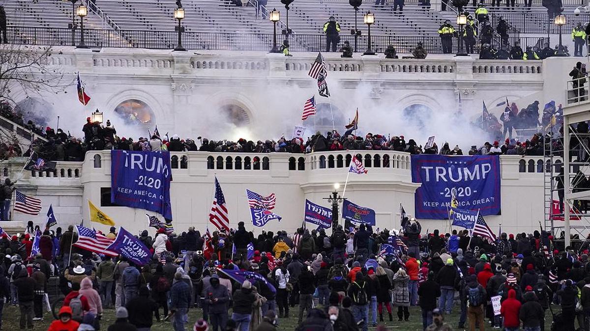 FILE - In this Wednesday, Jan. 6, 2021, file photo, violent protesters storm the Capitol, in Washington. A new Senate report documents intelligence and communication breakdowns in the lead up to the riot. (AP Photo/John Minchillo, File)