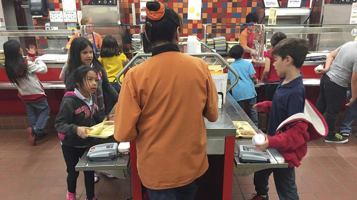 Associated Press archive photo of a school lunch program. (AP Photo/Morgan Lee)