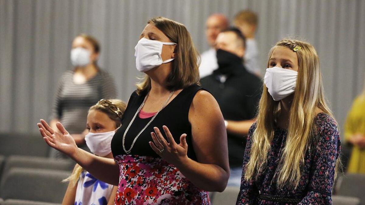 Parishioners sing during a service at Grace Bible Church on May 24 in Tempe, Arizona.