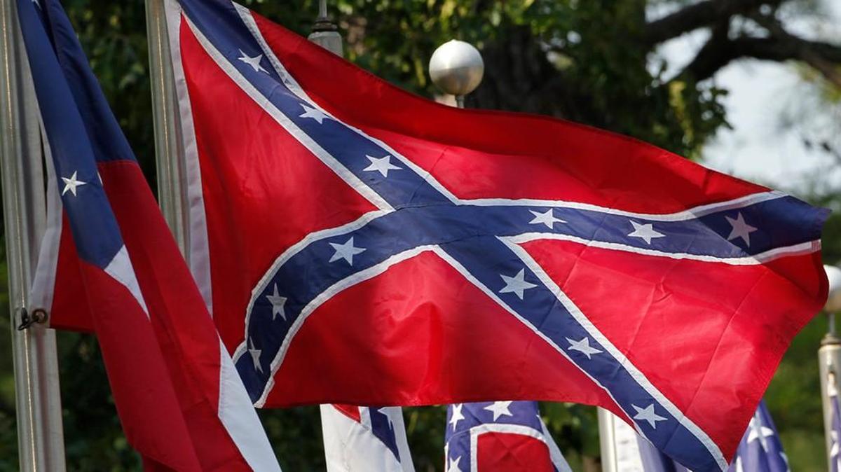 Police are looking for three suspects after they say one of them beat up a black teenager who yelled at them for driving around waving a large Confederate flag at the Willamette Country Music Festival in Oregon.