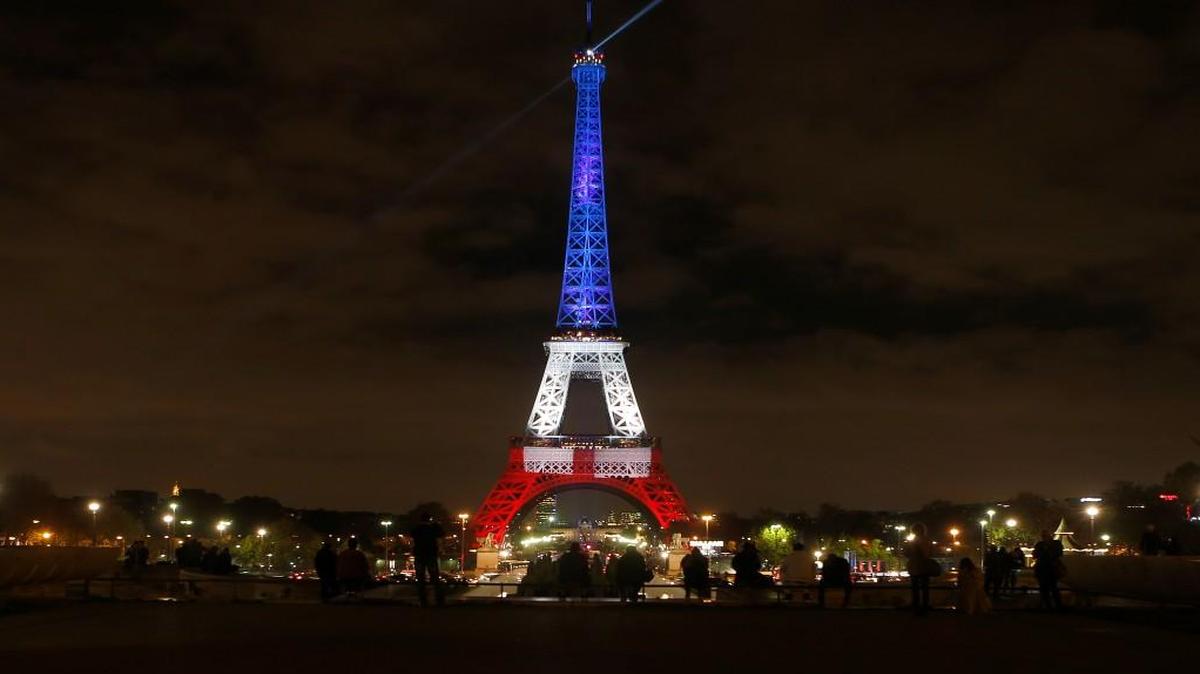 The Eiffel Tower in Paris was illuminated in the colors of the French flag Monday to honor victims of the terrorist attacks in the city last week.