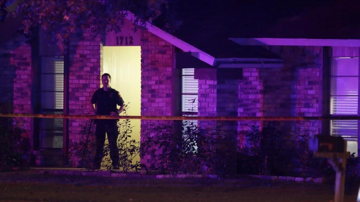 A police officer stands guard outside the scene of a mass shooting in Plano, Texas, on Sept. 10, 2017.