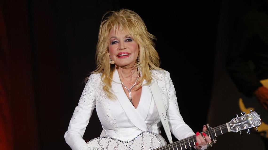 In this July 31, 2015, file photo, Dolly Parton performs in concert at the Ryman Auditorium in Nashville, Tenn. (Photo by Wade Payne/Invision/AP, File)