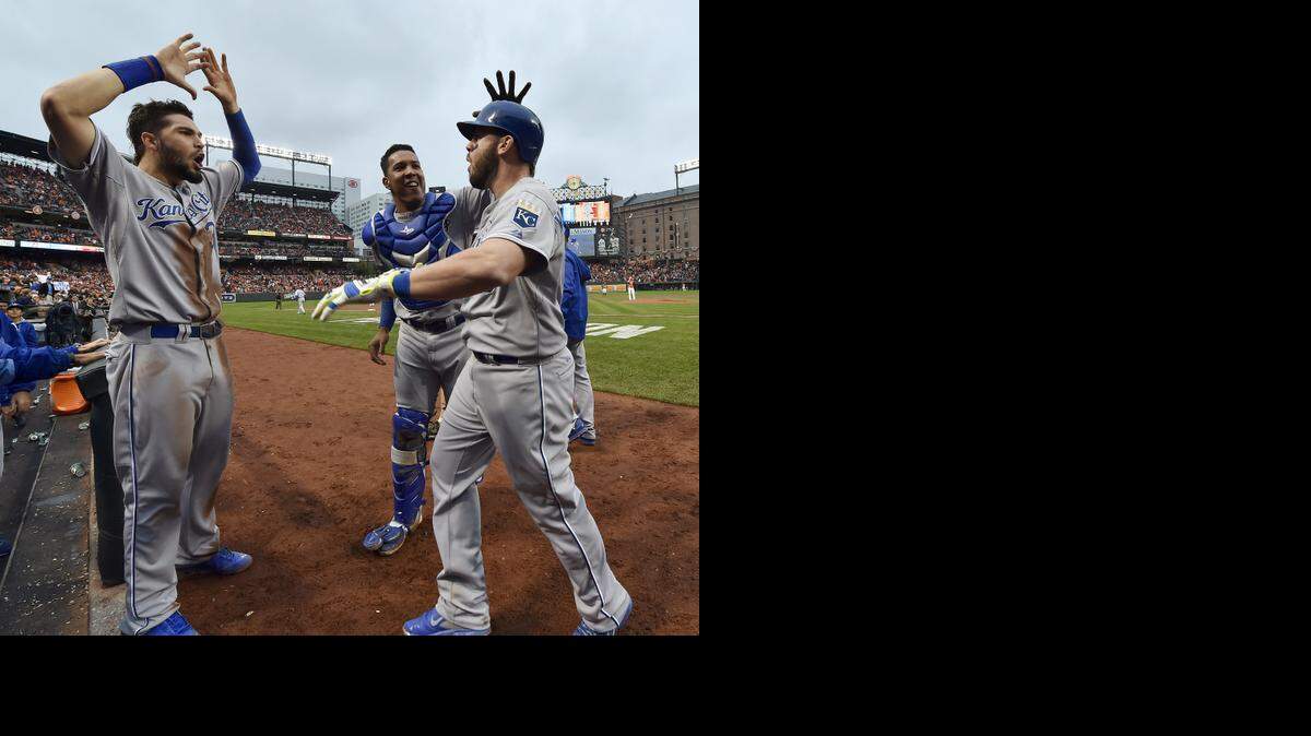 
Mike Moustakas (right) celebrated with teammate Salvador Perez center) and Eric Hosmer (left) after Moustakas hit a solo home run during the fourth inning against the Baltimore Orioles on Oct. 11, 2014, at Camden Yards in Baltimore, Md.
