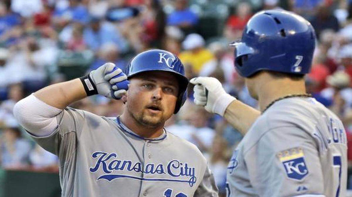 
Kansas City Royals designated hitter Billy Butler (16) celebrated his solo home run with teammate Josh Willingham (7) during the second inning of a baseball game against the Texas Rangers on Aug. 22, 2014, in in Arlington, Texas. 
