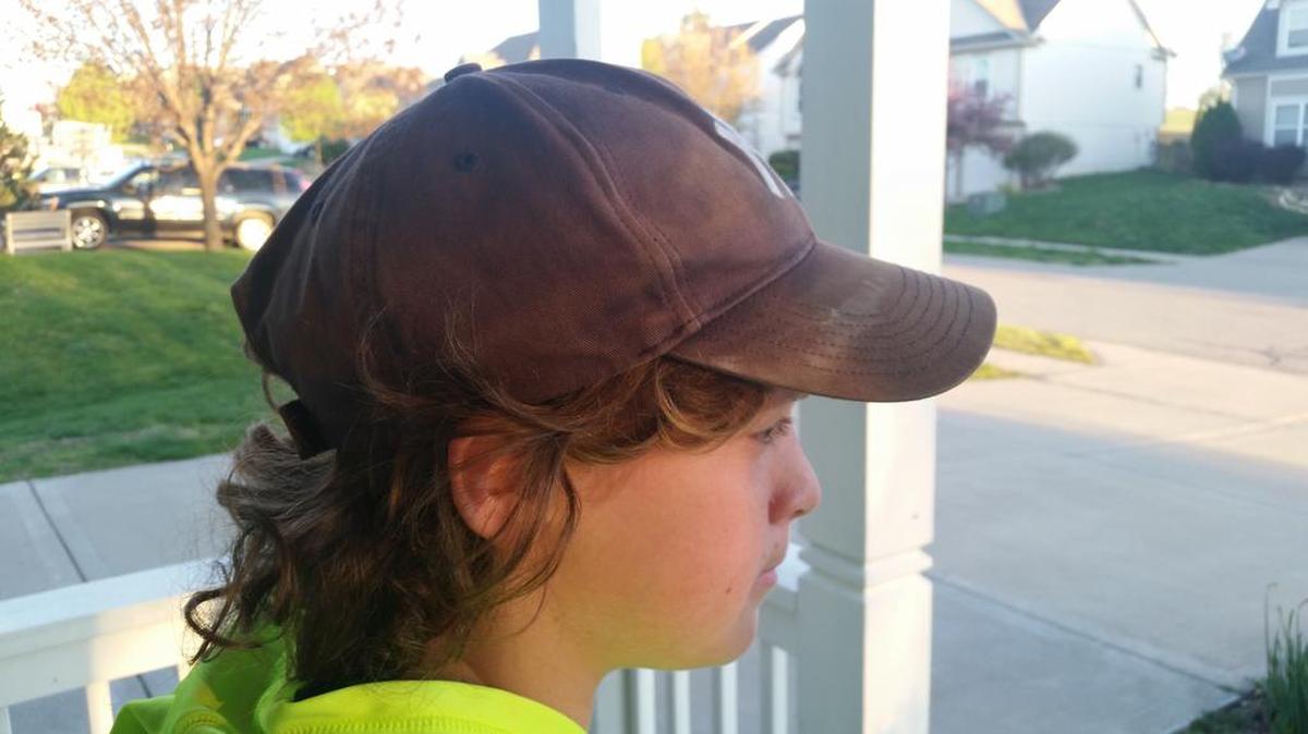It’s all in the eyes of the beholder. To the mom, a sweaty, tattered ball cap to be hidden. To the son, a lucky ball cap, a gift from the dad, to be treasured.