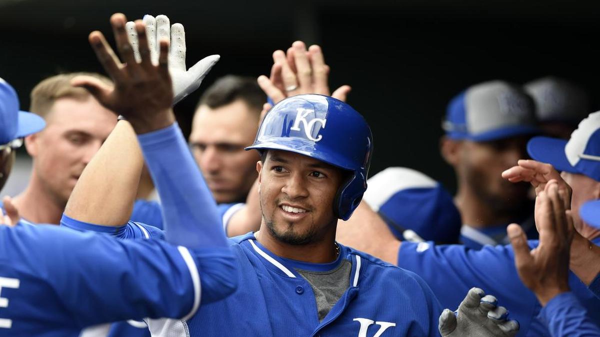 
Kansas City Royals Cheslor Cuthbert (61) gave teammates high-fives in the dugout after hitting a home run during spring training.
