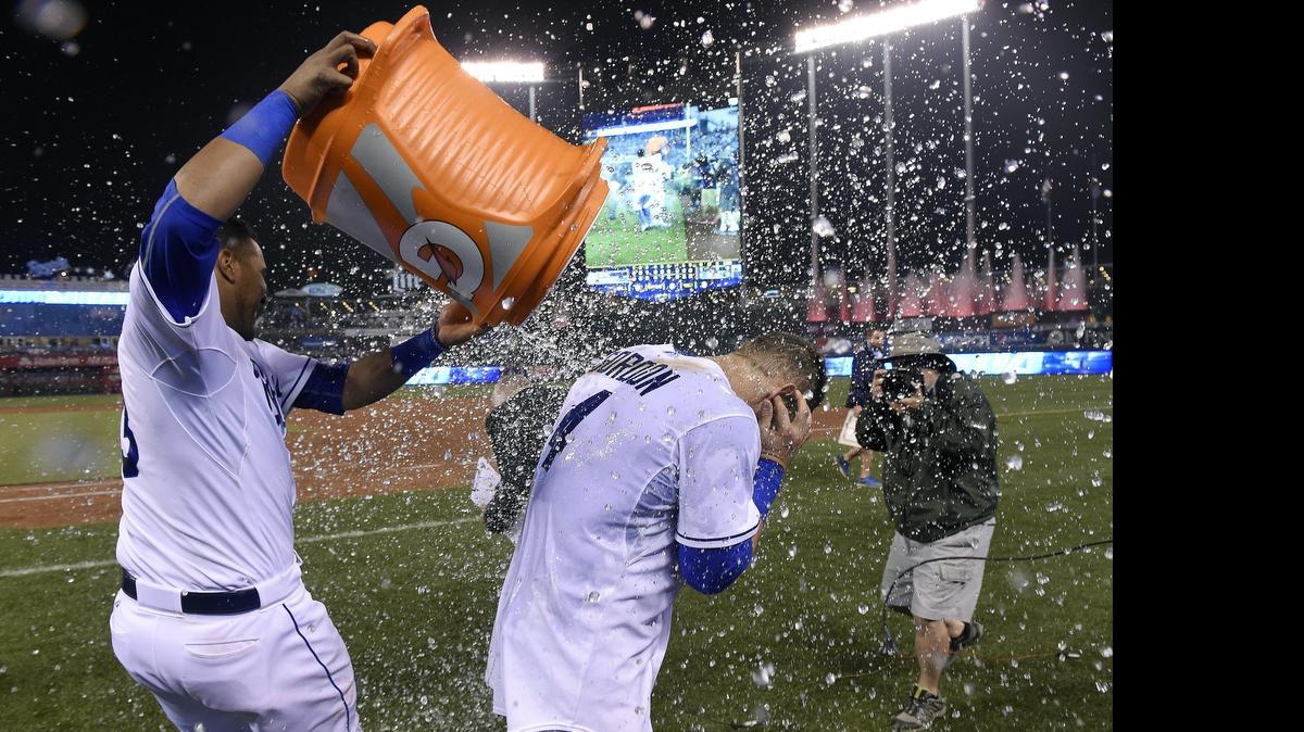 
Alex Gordon gets help with a shower from Salvador Perez after the Royals’ 7-1 win over the Tampa Bay Rays
