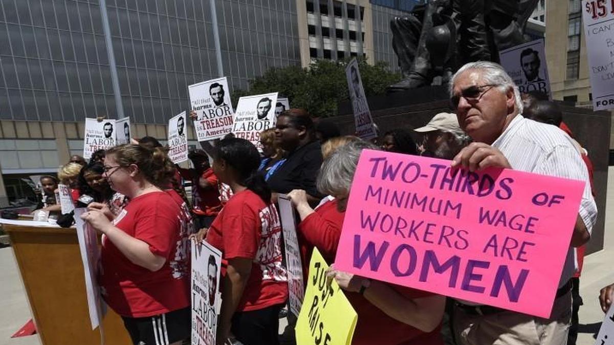 About 40 people, including fast-food workers and local faith leaders, gathered over the lunch hour on the south side of City Hall last year to urge the City Council to approve a minimum wage increase to $15 an hour by 2020. Many people working for low wages and struggling to make ends meet are women.