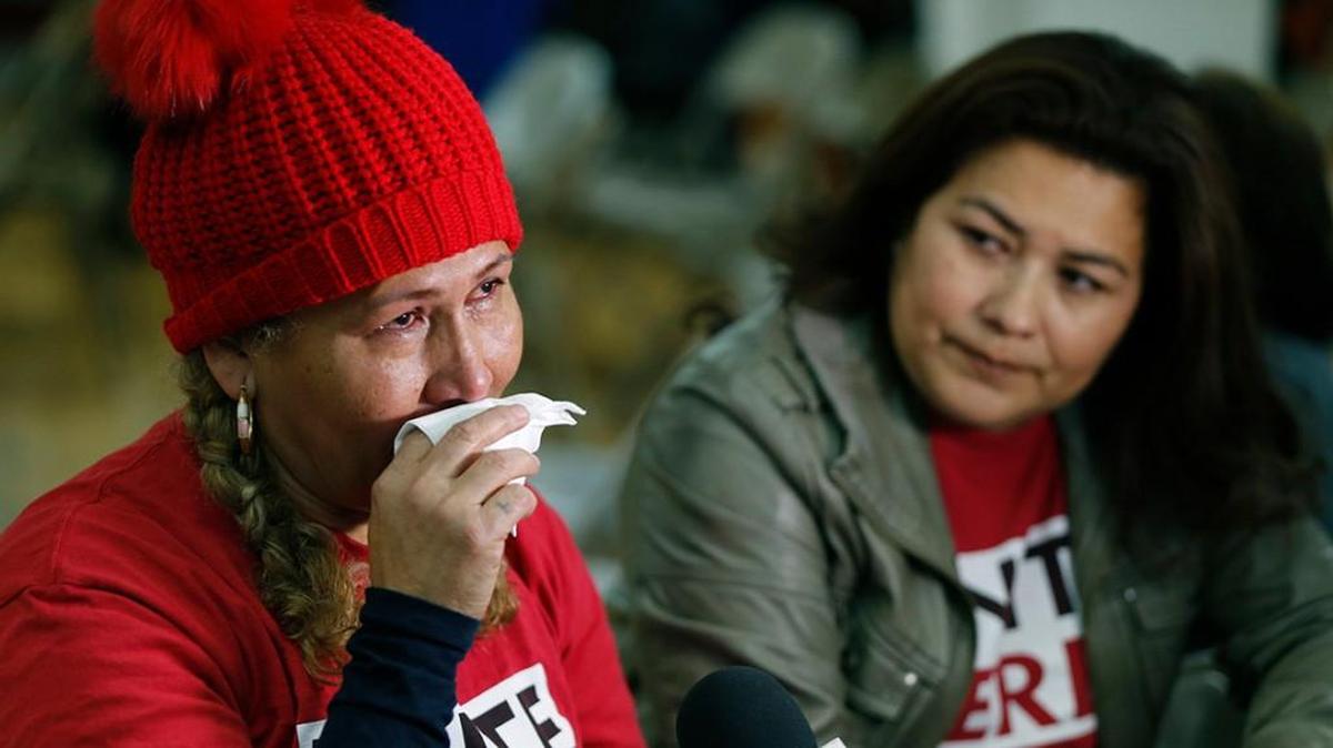 El Salvador immigrants Diana Paredes, left, and Isabel Barrera, react at a news conference following an announcement about Temporary Protected Status in Los Angeles on Jan. 8.