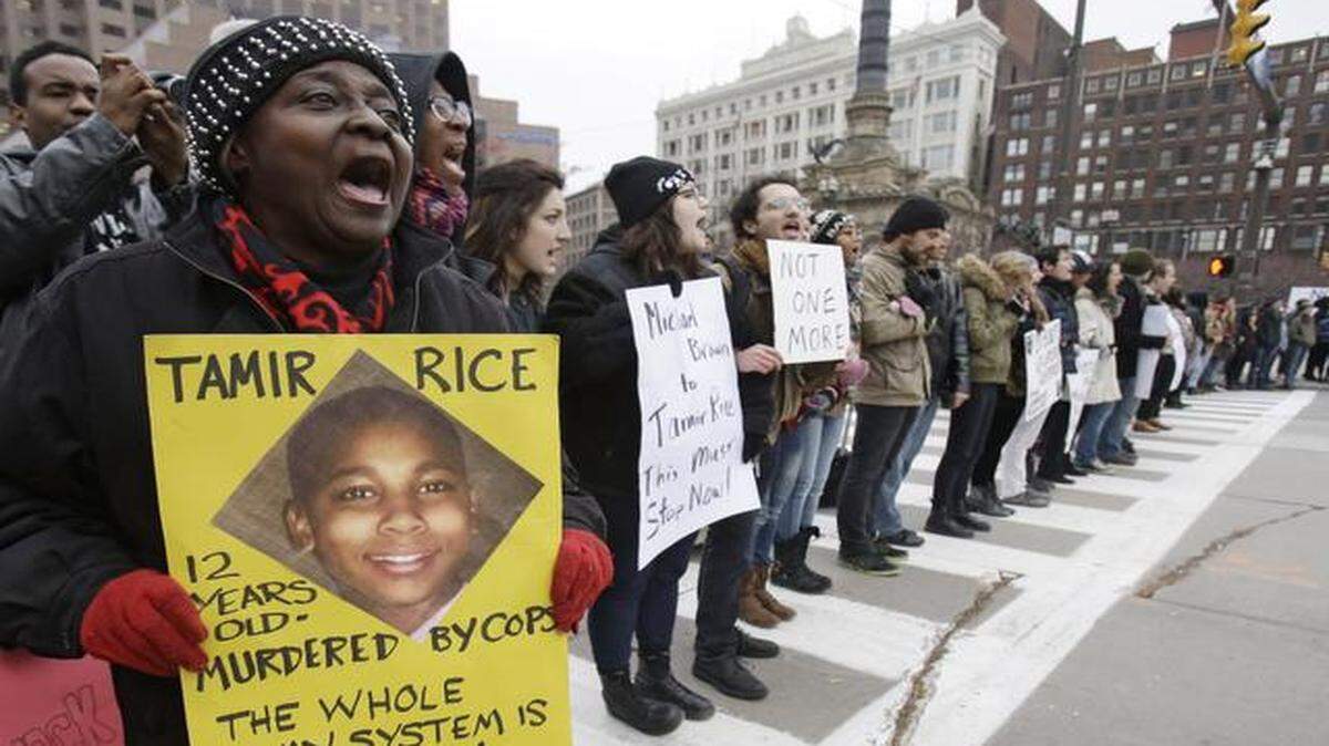 
People in Cleveland protest the police shooting of Tamir Rice. The 12-year-old was fatally shot by a Cleveland officer in November after he allegedly pulled a replica of a gun at a city park.
