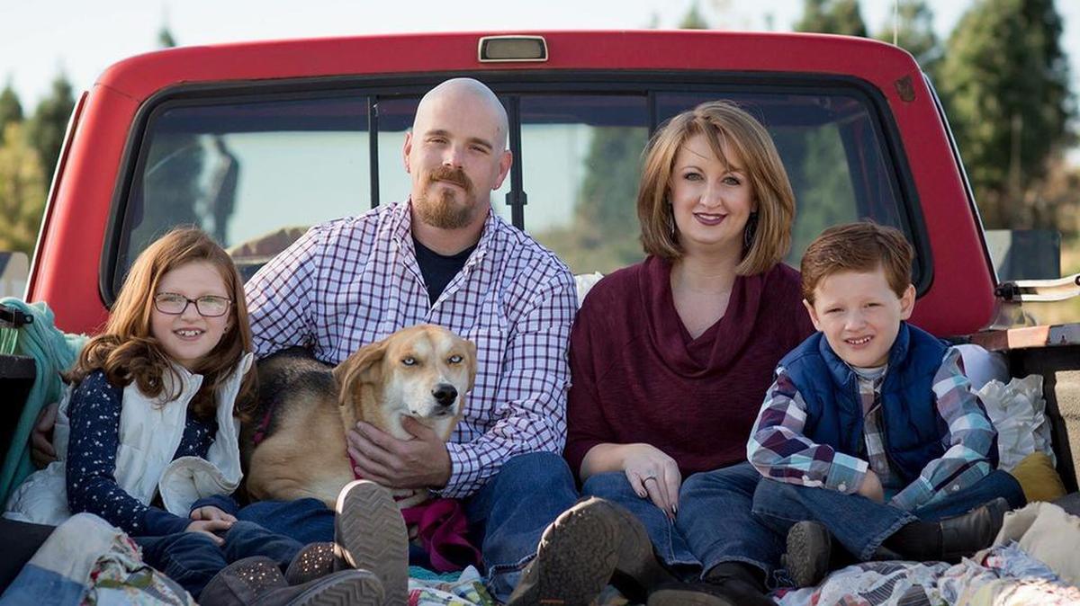 Kevin Amos, holding dog Ruby, with (left to right) daughter Isabella, 11, wife Becky and son Nash, 9.