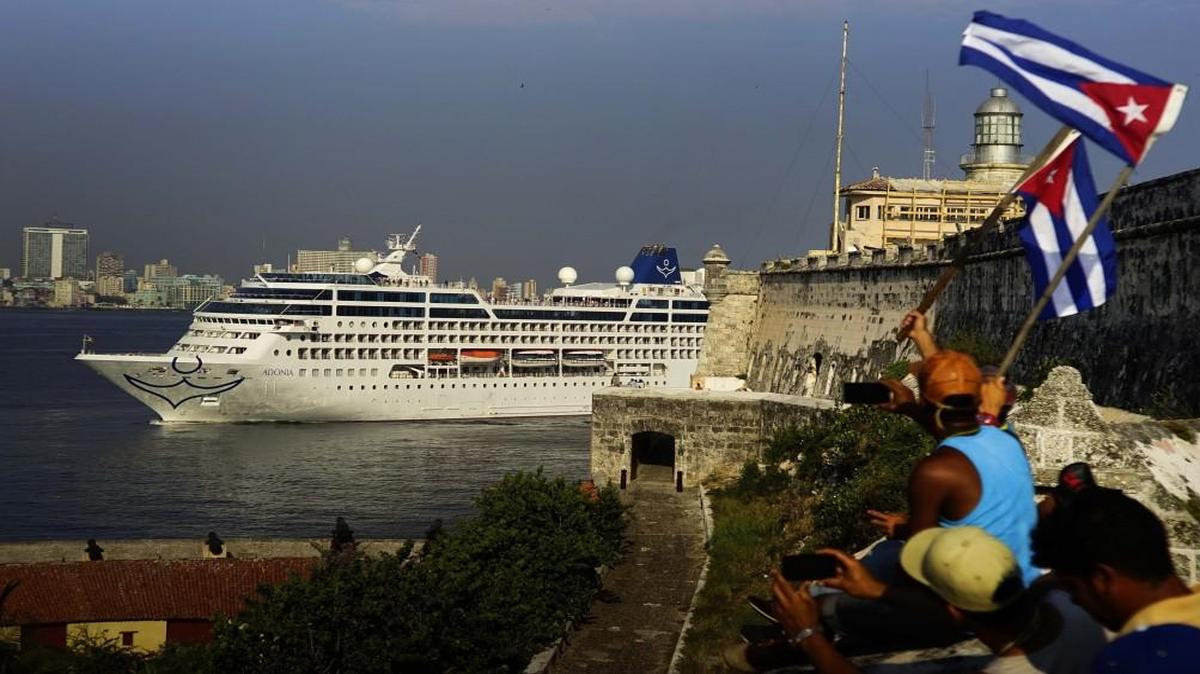 People in Havana waving Cuban flags greeted passengers on Carnival’s Adonia cruise ship as they arrived in May from Miami. The Adonia’s arrival was the first step toward a future in which thousands of ships a year could cross the Florida Straits, long closed to most U.S.-Cuba traffic.