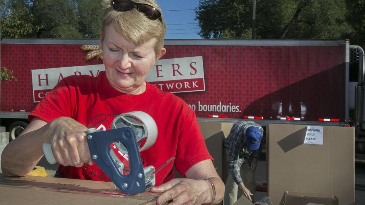 Sally Ryan of Kansas City assembled boxes for Harvesters.