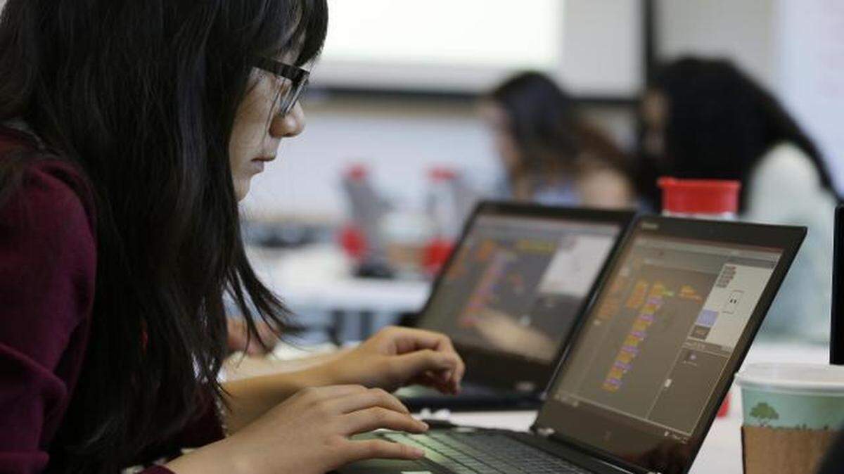
Annie Ly, 16, works on completing an exercise during a Girls Who Code class at Adobe Systems in San Jose, Calif. Google is partnering with Girls Who Code, a national nonprofit organization that aims to inspire, educate and equip young women for futures in computing-related fields.
