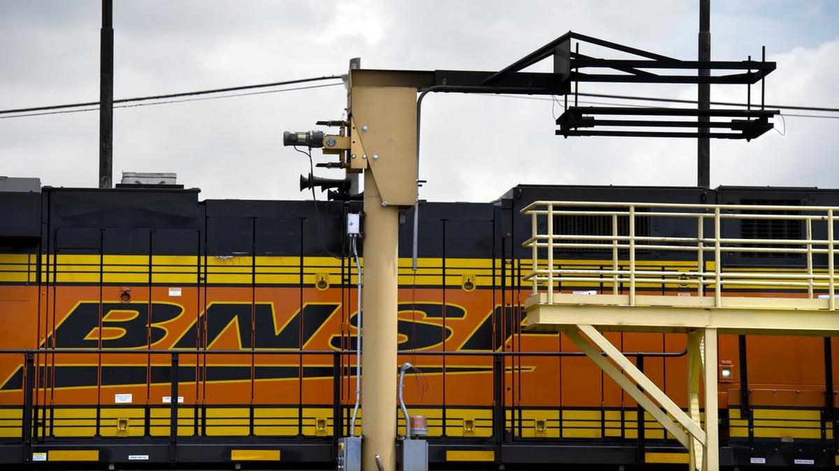 
A monitor (upper right) is used to test diesel exhaust at the BNSF Railway Locomotive Maintenance Inspection Terminal in the Argentine rail yard. When in use, the device swings out over the locomotive and is positioned above the exhaust.
