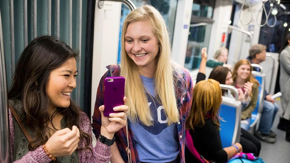 UMKC students ride the streetcar in downtown Kansas City.