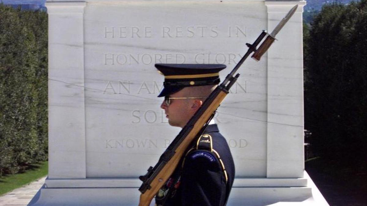 An unidentified Army Sentry guards the Tomb of the Unknowns at Arlington National Cemetery in Arlington, Va., after a ceremony marking POW-MIA Recognition Day. People will remember veterans and those who continue to serve on Memorial Day.