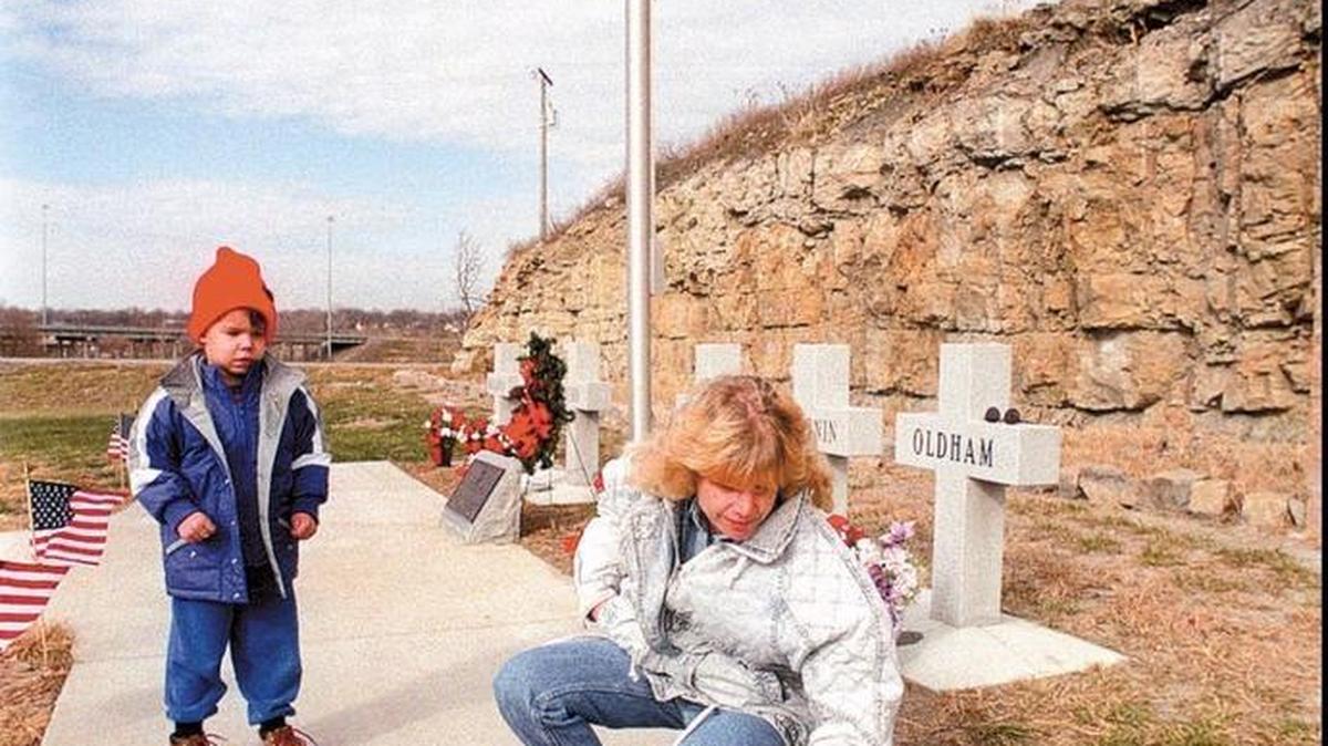 A memorial near U.S. 71 and 87th Street in south Kansas City honors six firefighters who were killed there in an explosion on Nov. 29, 1988. Janice Offill explained to her then-4-year-old son, Sean, the importance of a new plaque displaying ‘A Fireman’s Prayer.’ Offill’s brother, Michael Oldham, was one of the men who died in the blast.