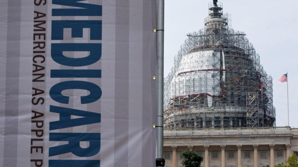 FILE - In this July 30, 2015 file photo, a sign supporting Medicare is seen on Capitol Hill in Washington as registered nurses and other community leaders celebrate the 50th anniversary of Medicare and Medicaid.
