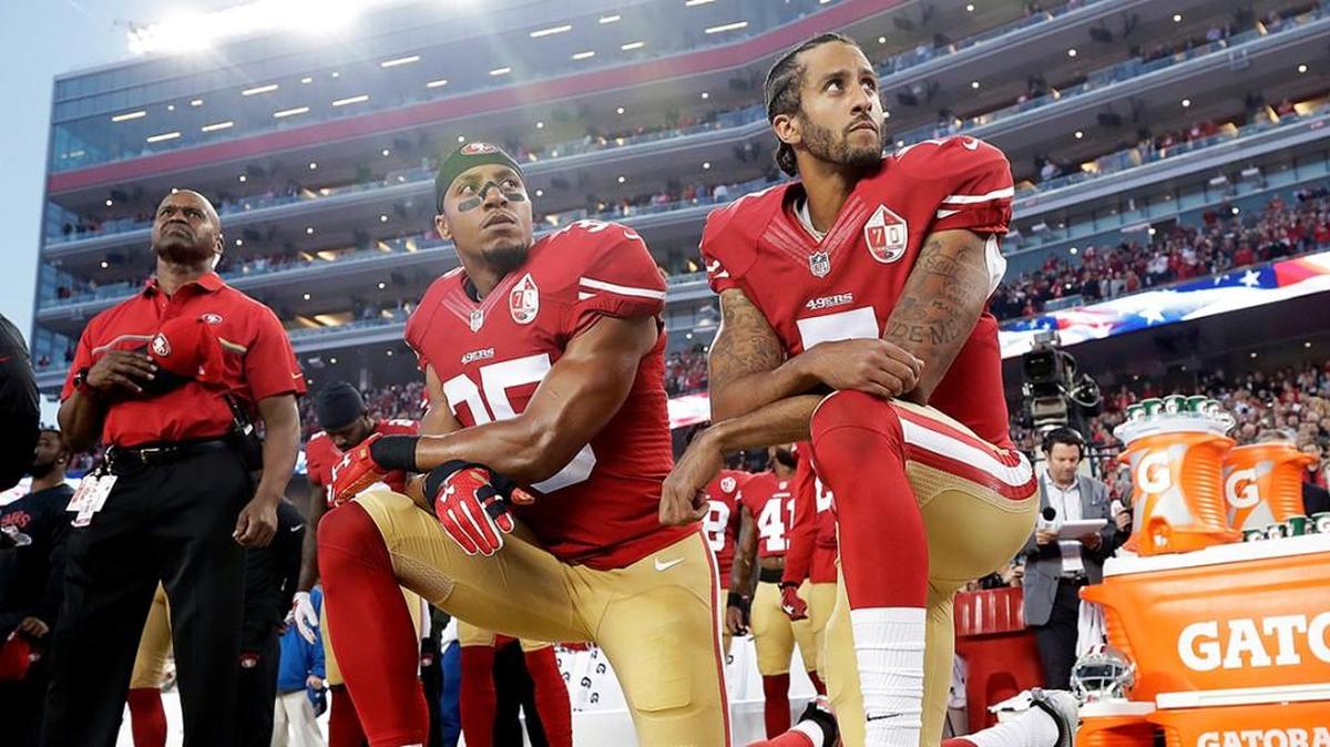FILE - Int his Monday, Sept. 12, 2016, file photo, San Francisco 49ers safety Eric Reid (35) and quarterback Colin Kaepernick (7) kneel during the national anthem before an NFL football game against the Los Angeles Rams in Santa Clara, Calif. The dozen NFL players who have joined Kaepernickâ€™s protest of social injustices by kneeling or raising a fist during the national anthem have faced vitriolic, sometimes racist reactions on social media and at least one has lost endorsements. None are deterred by the backlash. (AP Photo/Marcio Jose Sanchez, File)