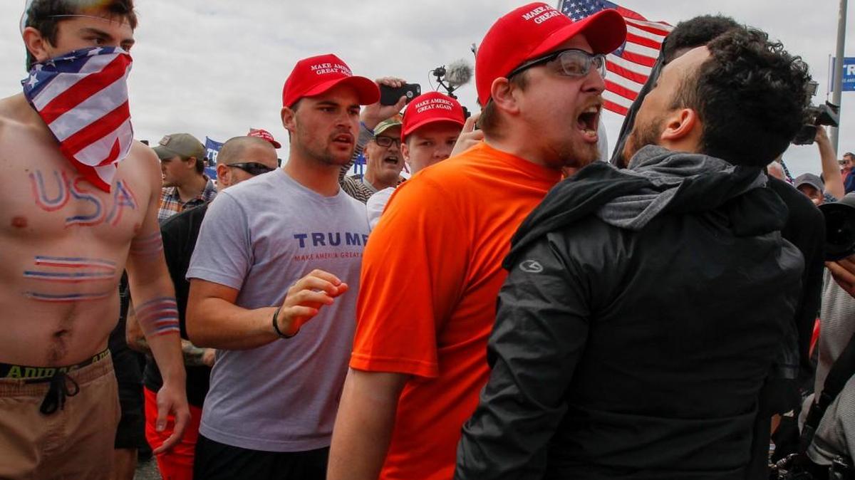 A scuffle breaks out during a Make America Great Again March on Saturday, March 25, 2017, in Huntington Beach, Calif.
