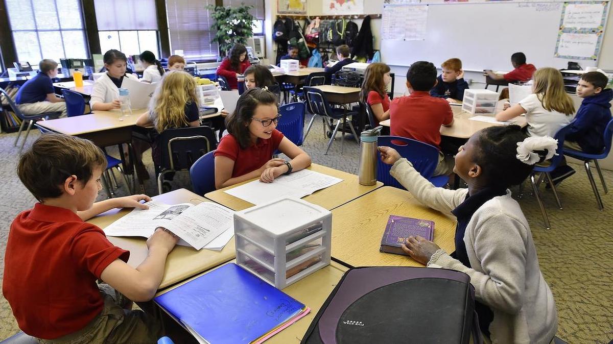 Fourth-grade students gather in their homeroom at the popular Academie Lafayette charter school in Kansas City.