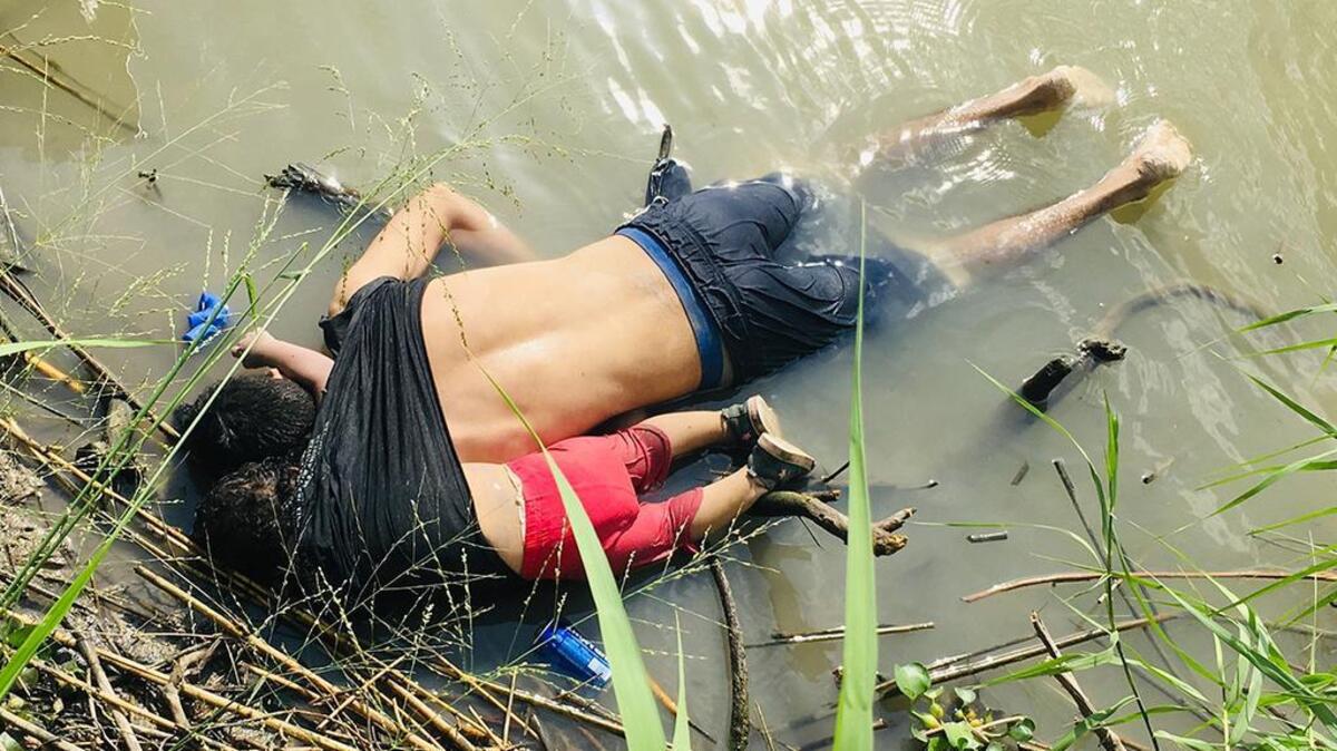 The bodies of Salvadoran migrant Óscar Alberto Martínez Ramírez and his 23-month-old daughter, Valeria, lie on the bank of the Rio Grande in Matamoros, Mexico, on June 24, 2019, after they drowned trying to cross the river to Brownsville, Texas. Martinez’ wife, Tania told Mexican authorities she watched her husband and child disappear in the strong current.